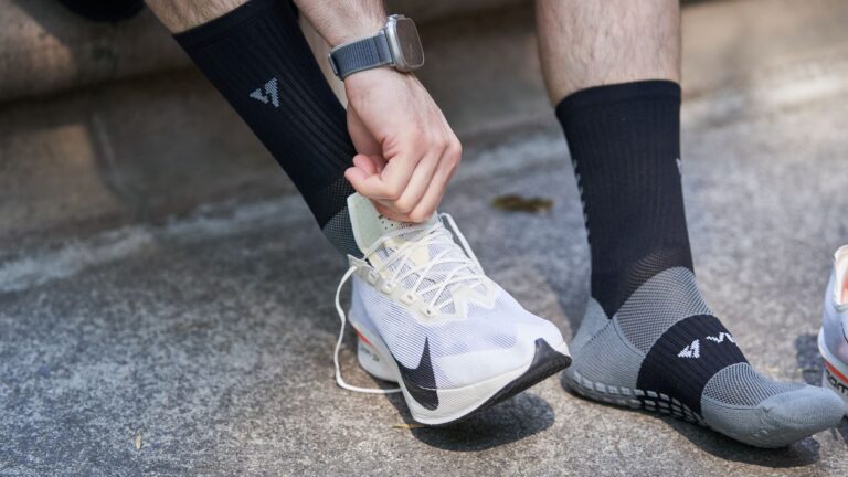 A clean product photo illustrating compression socks runners performance recovery.